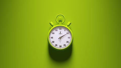 A green stopwatch showing 60 seconds on a green background, casting a shadow below.